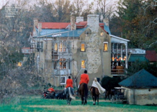People on horsback and old farmhouse