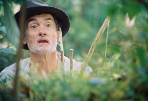 Nate peers over vegetation